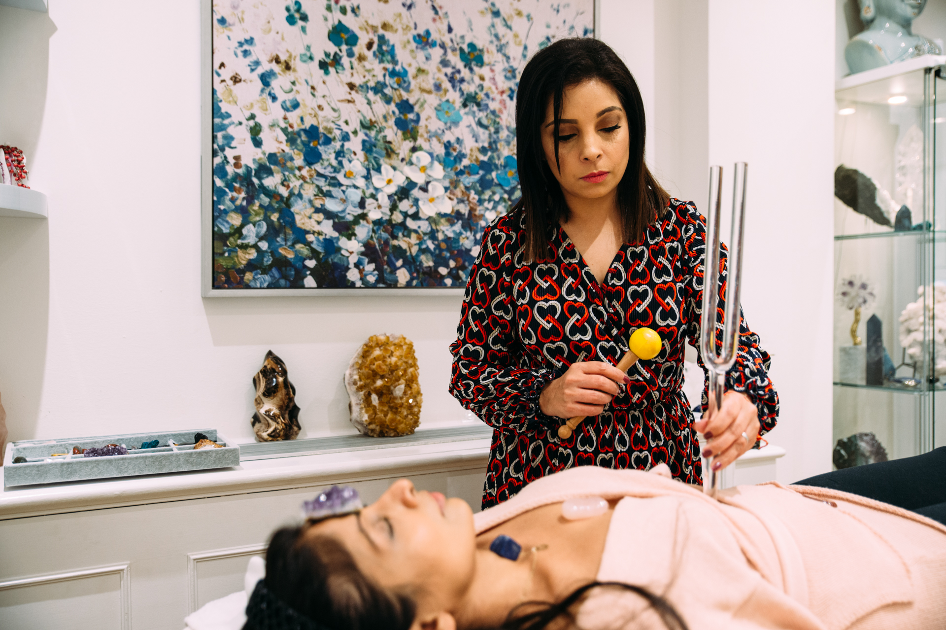 Reeya Avani performing a Reiki healing session
